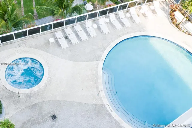 a view of a swimming pool with a lake view