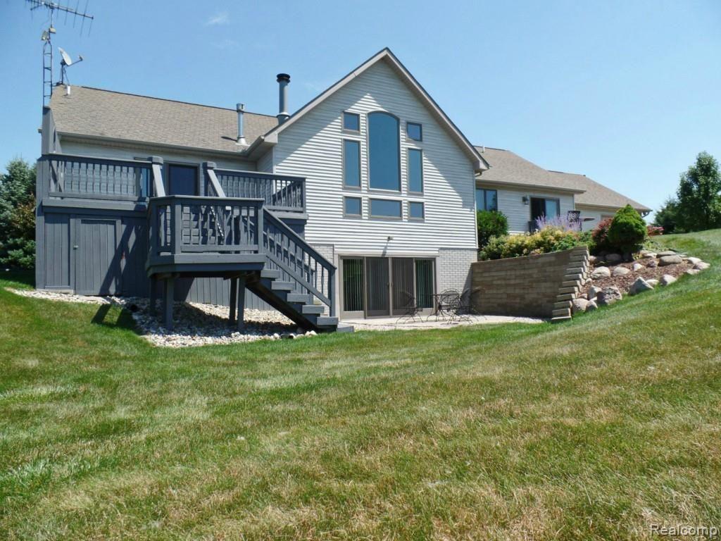 6340 Vassar Road Grand Blanc, MI 48439 - Photo 3 of 51 Rear view of home. Note the walkout lower level, brick paver patio and multi-level deck off of the master bedroom suite.