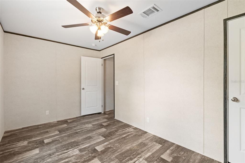 5350 Northeast 108th Terrace Bronson, FL 32621 - Photo 17 of 24 a view of a room with a ceiling fan