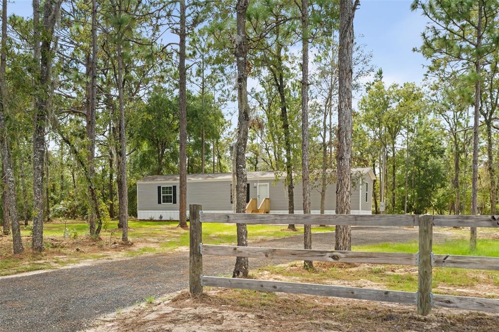 5350 Northeast 108th Terrace Bronson, FL 32621 - Photo 2 of 24 a view of a swimming pool with a patio