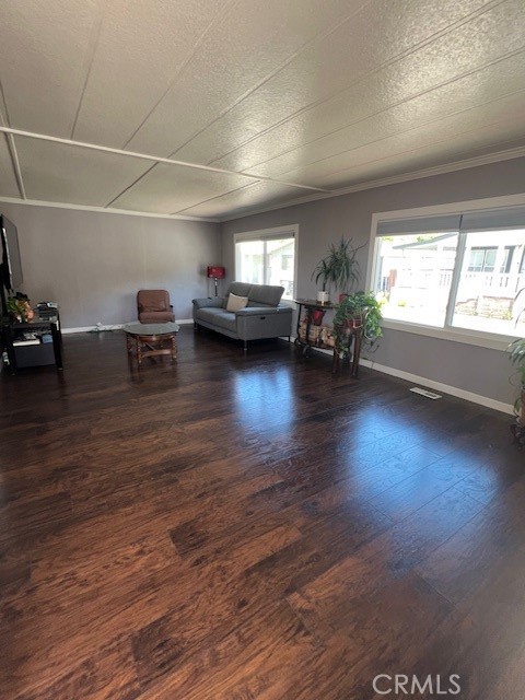 4901 Green River Road, Unit 104 Corona, CA 92878 - Photo 11 of 59 a living room with furniture and a wooden floor