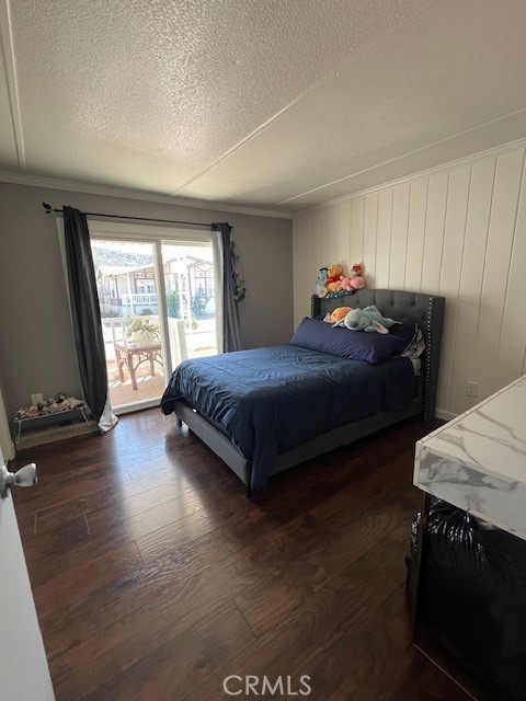 4901 Green River Road, Unit 104 Corona, CA 92878 - Photo 20 of 59 a bedroom with a bed and a night stand