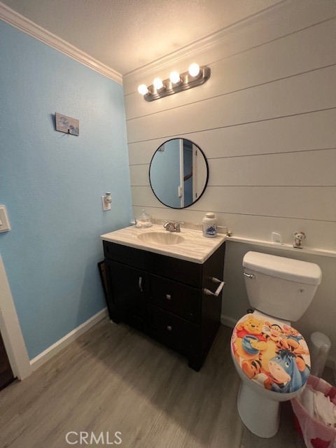 4901 Green River Road, Unit 104 Corona, CA 92878 - Photo 26 of 59 a bathroom with a toilet sink vanity and mirror