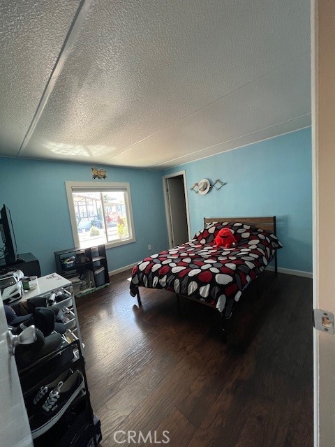 4901 Green River Road, Unit 104 Corona, CA 92878 - Photo 27 of 59 a bed sitting in a bedroom next to a window
