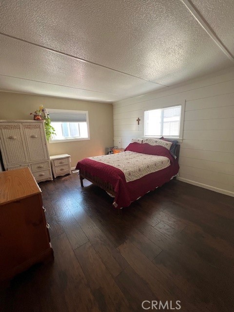 4901 Green River Road, Unit 104 Corona, CA 92878 - Photo 29 of 59 a bedroom with a bed and window