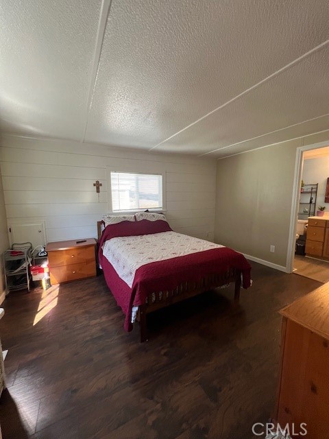 4901 Green River Road, Unit 104 Corona, CA 92878 - Photo 30 of 59 a spacious bedroom with a bed and a table in it