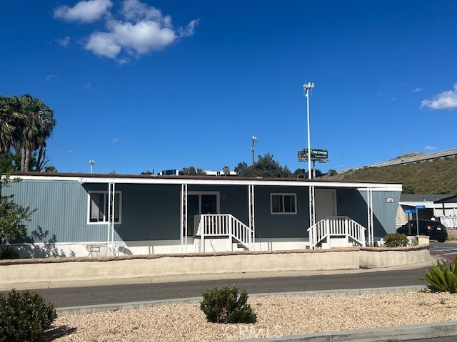 4901 Green River Road, Unit 104 Corona, CA 92878 - Photo 3 of 59 a view of a house with a outdoor space