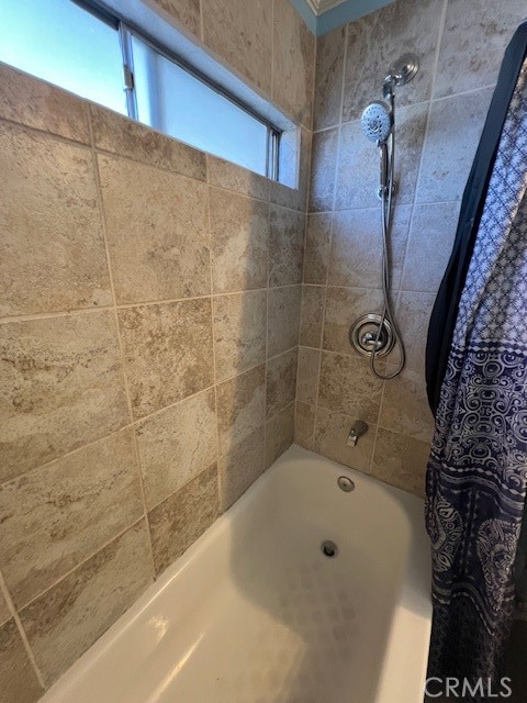 4901 Green River Road, Unit 104 Corona, CA 92878 - Photo 34 of 59 a bathroom with a bathtub