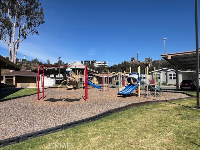 4901 Green River Road, Unit 104 Corona, CA 92878 - Photo 45 of 59 a view of a house with swimming pool and sitting area