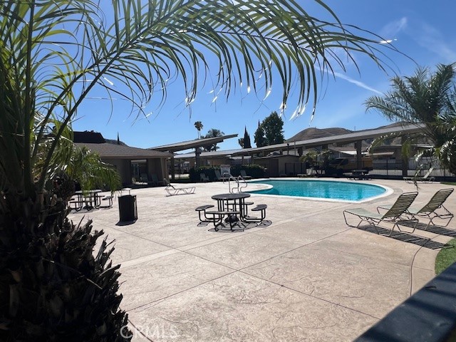 4901 Green River Road, Unit 104 Corona, CA 92878 - Photo 46 of 59 a view of outdoor space with seating and green space