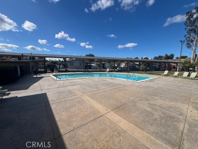 4901 Green River Road, Unit 104 Corona, CA 92878 - Photo 50 of 59 a view of an outdoor space and basketball court