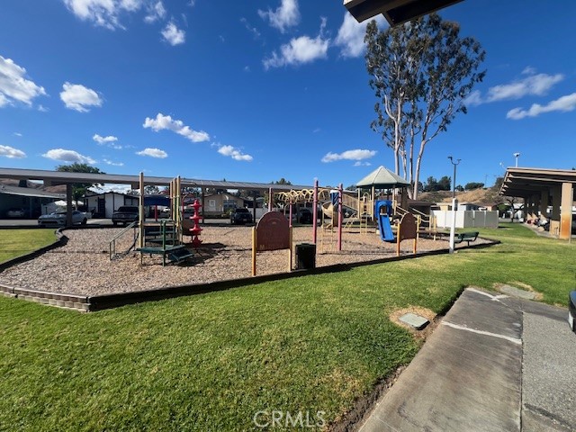 4901 Green River Road, Unit 104 Corona, CA 92878 - Photo 53 of 59 a view of a yard with table and chairs with a yard