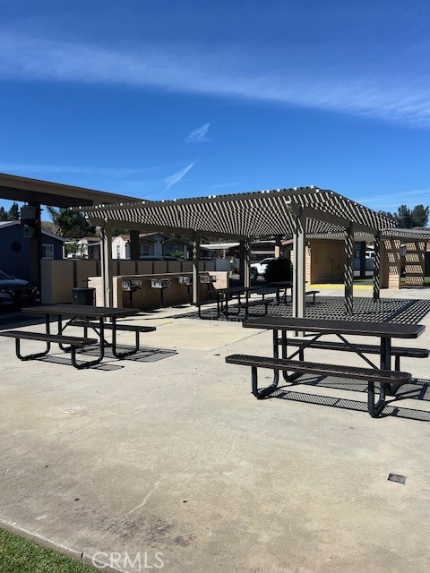 4901 Green River Road, Unit 104 Corona, CA 92878 - Photo 54 of 59 a view of a swimming pool with seating space
