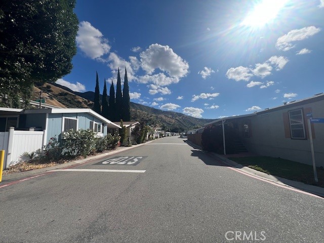 4901 Green River Road, Unit 104 Corona, CA 92878 - Photo 58 of 59 a view of a house with a yard