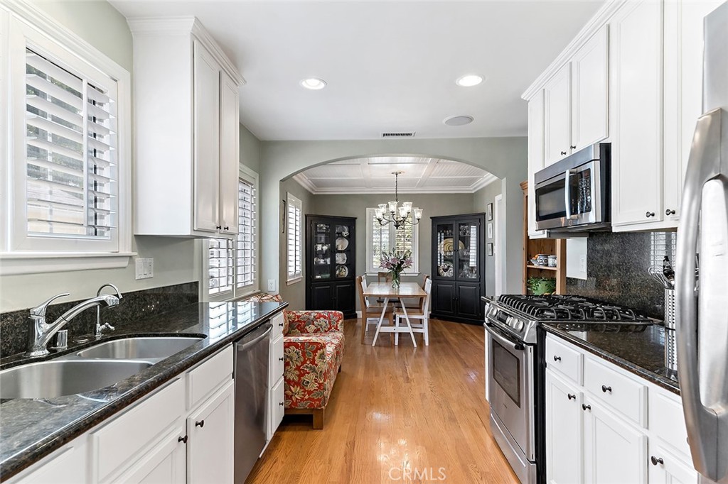 3432 Roxanne Avenue Long Beach, CA 90808 - Photo 13 of 41 a kitchen with counter top space a sink and appliances
