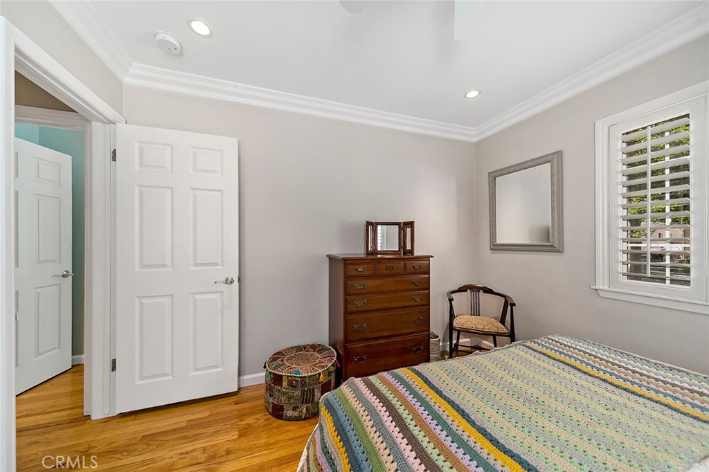 3432 Roxanne Avenue Long Beach, CA 90808 - Photo 16 of 41 a bedroom with a bed and wooden floor