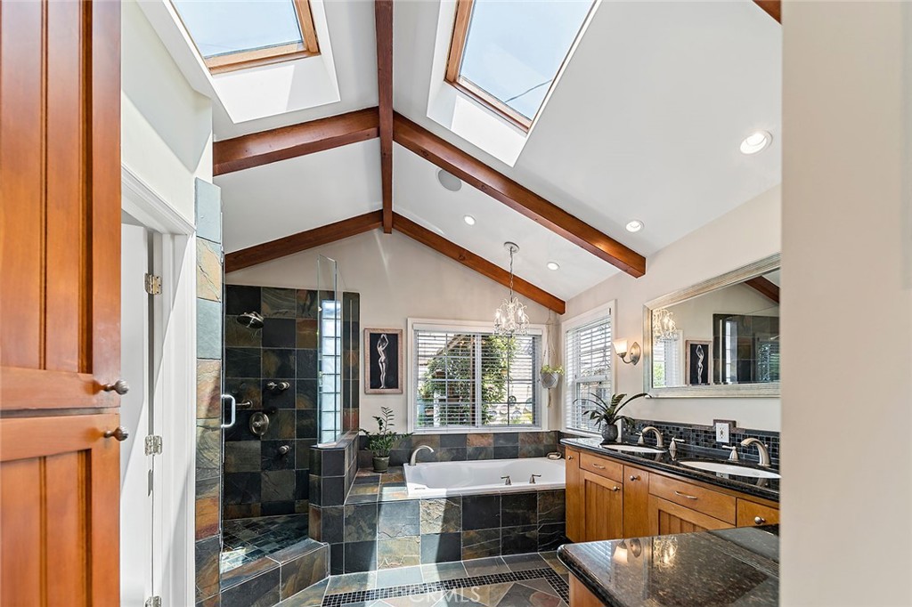 3432 Roxanne Avenue Long Beach, CA 90808 - Photo 23 of 41 a kitchen with stainless steel appliances granite countertop a stove and a sink