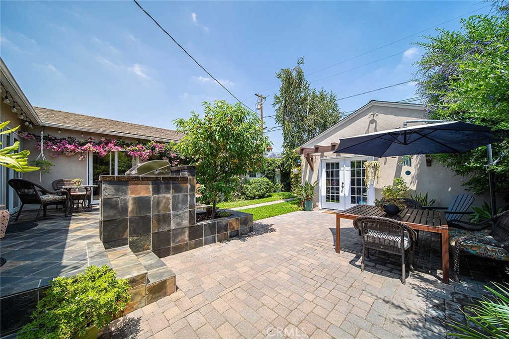 3432 Roxanne Avenue Long Beach, CA 90808 - Photo 30 of 41 Rear yard with patio area and custom garage area that is used for storage
