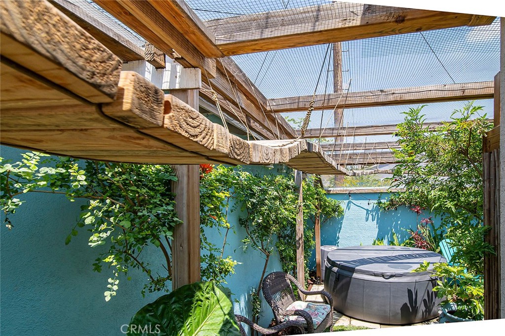 3432 Roxanne Avenue Long Beach, CA 90808 - Photo 32 of 41 a view of a patio with table and chairs and potted plants