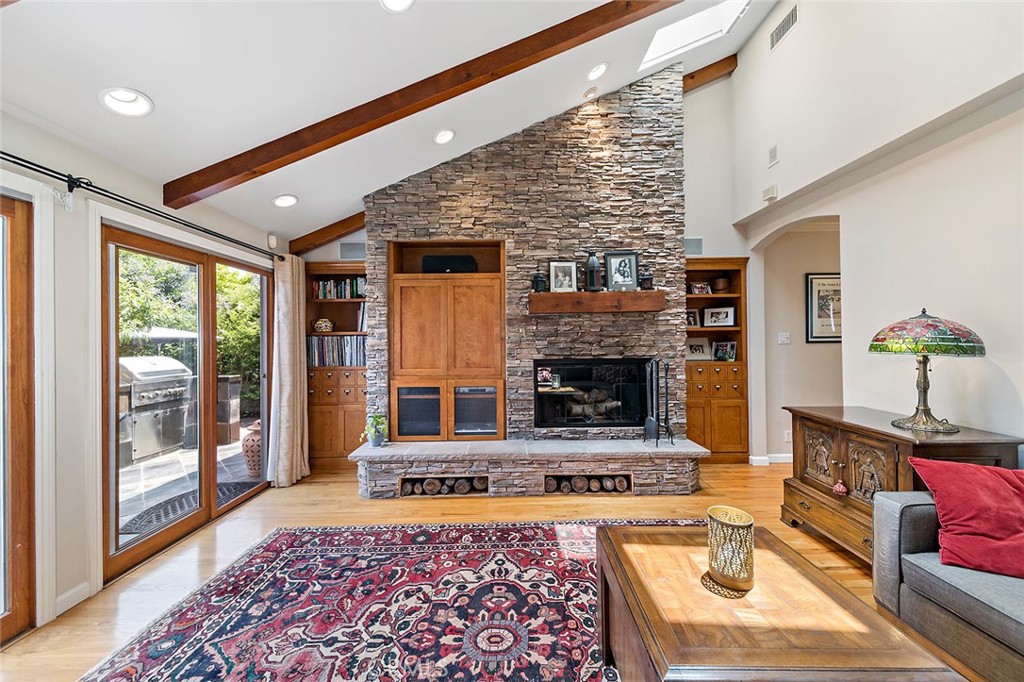 3432 Roxanne Avenue Long Beach, CA 90808 - Photo 4 of 41 a living room with furniture and a fireplace