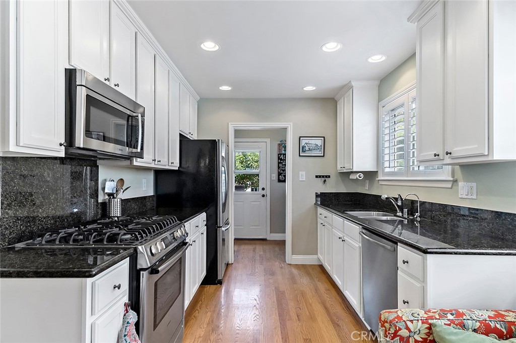 3432 Roxanne Avenue Long Beach, CA 90808 - Photo 7 of 41 Updated kitchen with canned lighting, custom shutters and newer appliances.