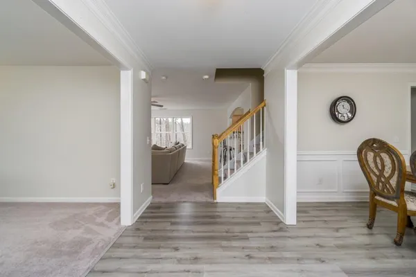 a view of entryway with wooden floor