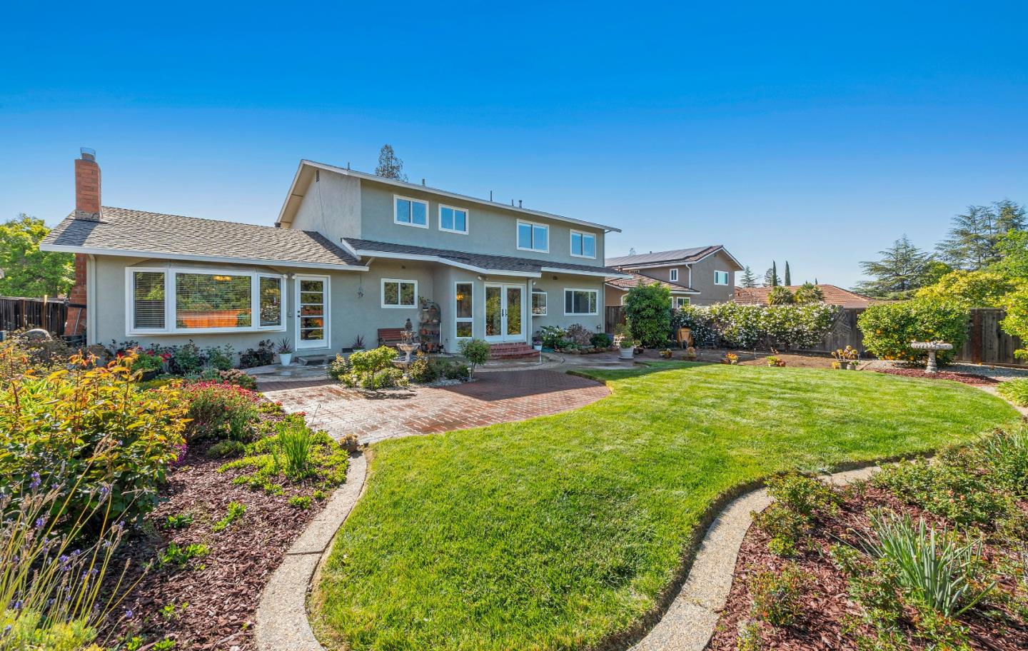 7126 Brooktree Way San Jose, CA 95120 - Photo 13 of 15 a front view of a house with swimming pool having outdoor seating