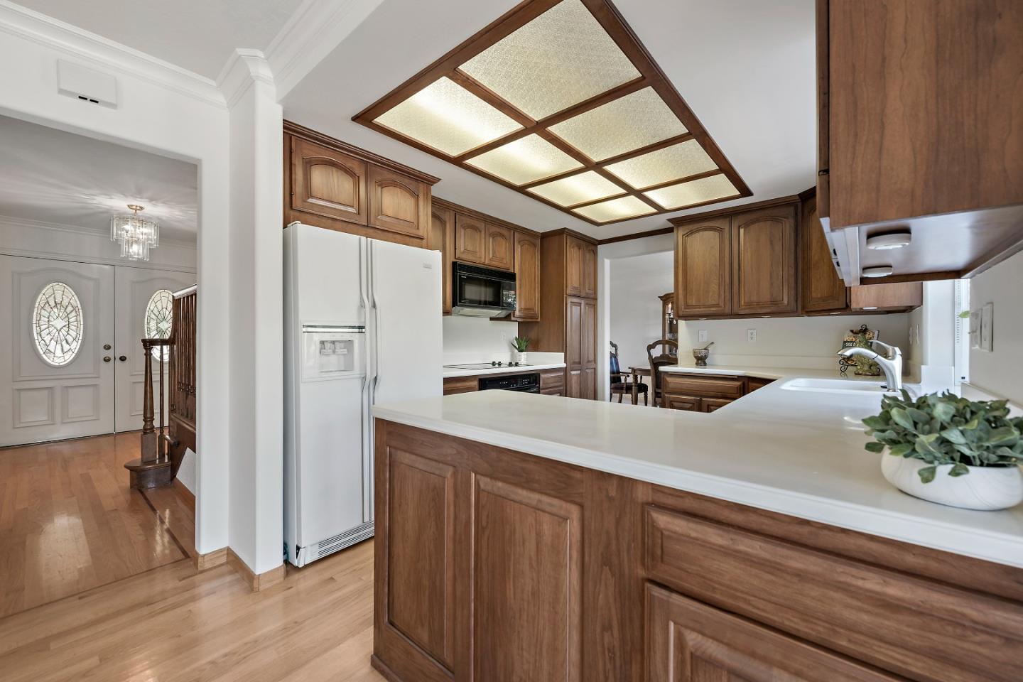 7126 Brooktree Way San Jose, CA 95120 - Photo 6 of 15 a kitchen with a sink and a refrigerator