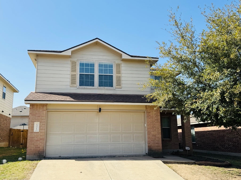 13312 Lismore Lane Pflugerville, TX 78660 - Photo 1 of 27 a view of a house with a yard