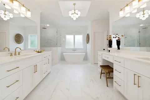 a bathroom with a double vanity sink mirror and