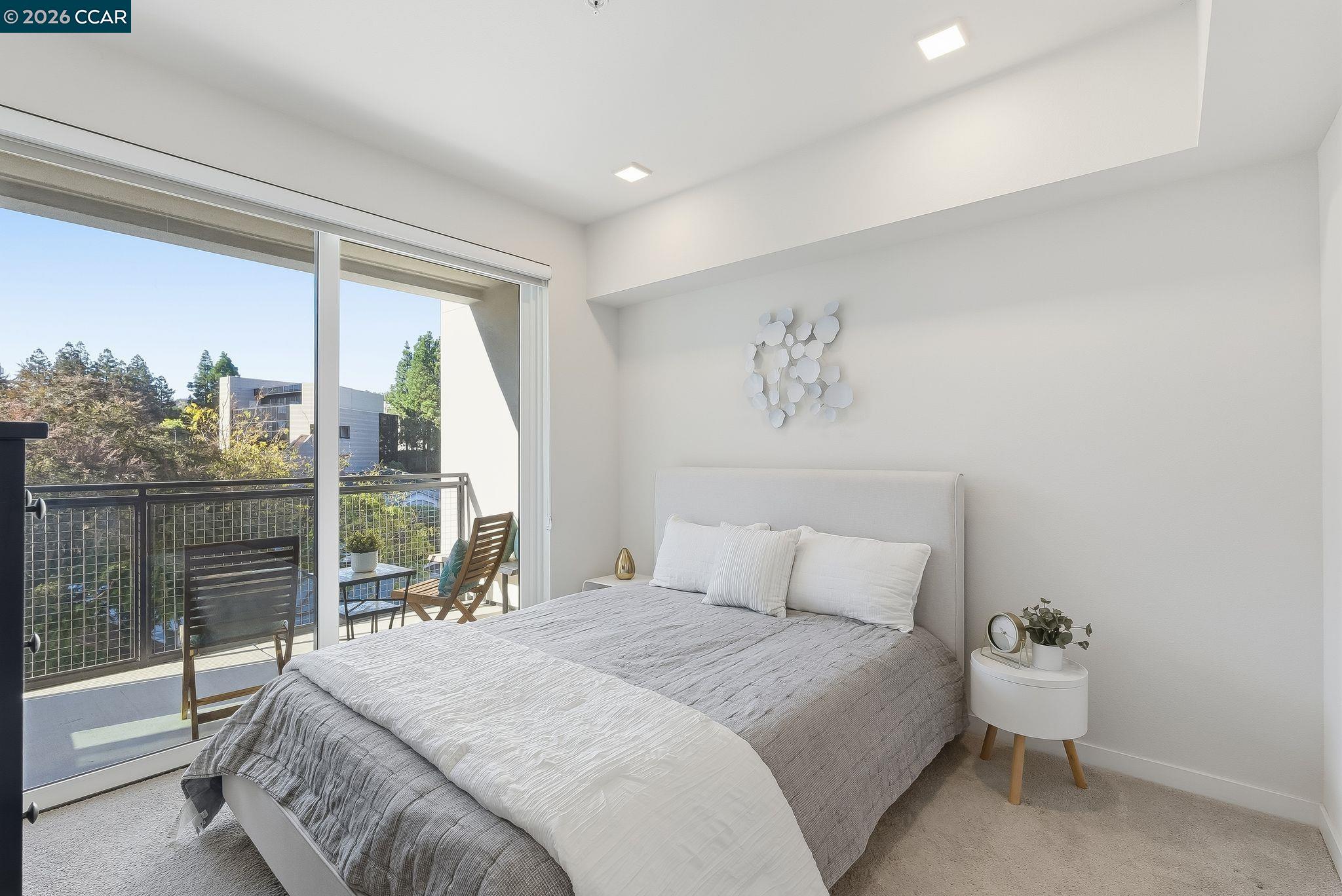 1605 Riviera Avenue, Unit 404 Walnut Creek, CA 94596 - Photo 16 of 45 a bedroom with a large bed and a large window