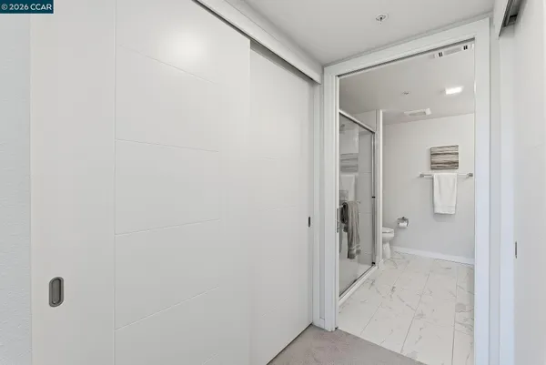 a bathroom with a shower and a sink