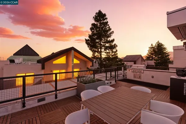 a view of a roof deck with couches