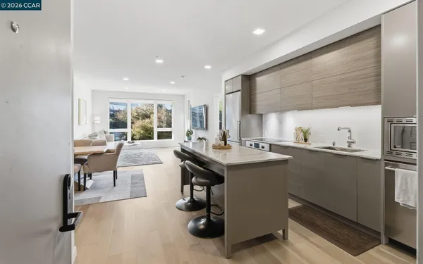 a kitchen with a sink cabinets and counter top space