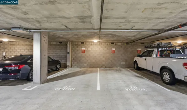 a view of parking garage with cars