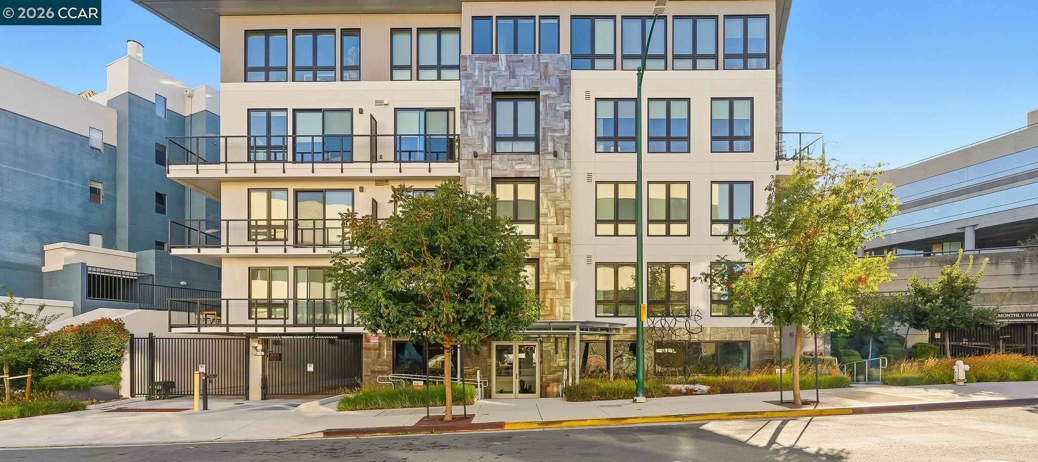 1605 Riviera Avenue, Unit 404 Walnut Creek, CA 94596 - Photo 44 of 45 a front view of a building with a garden