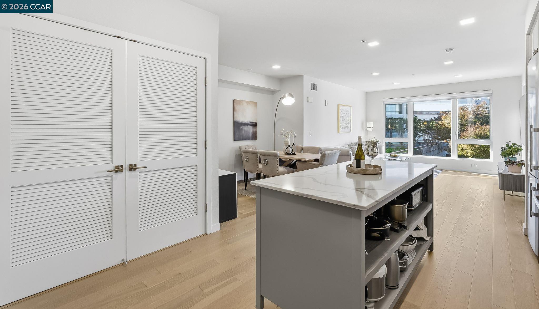 1605 Riviera Avenue, Unit 404 Walnut Creek, CA 94596 - Photo 7 of 45 a kitchen with counter top space and windows