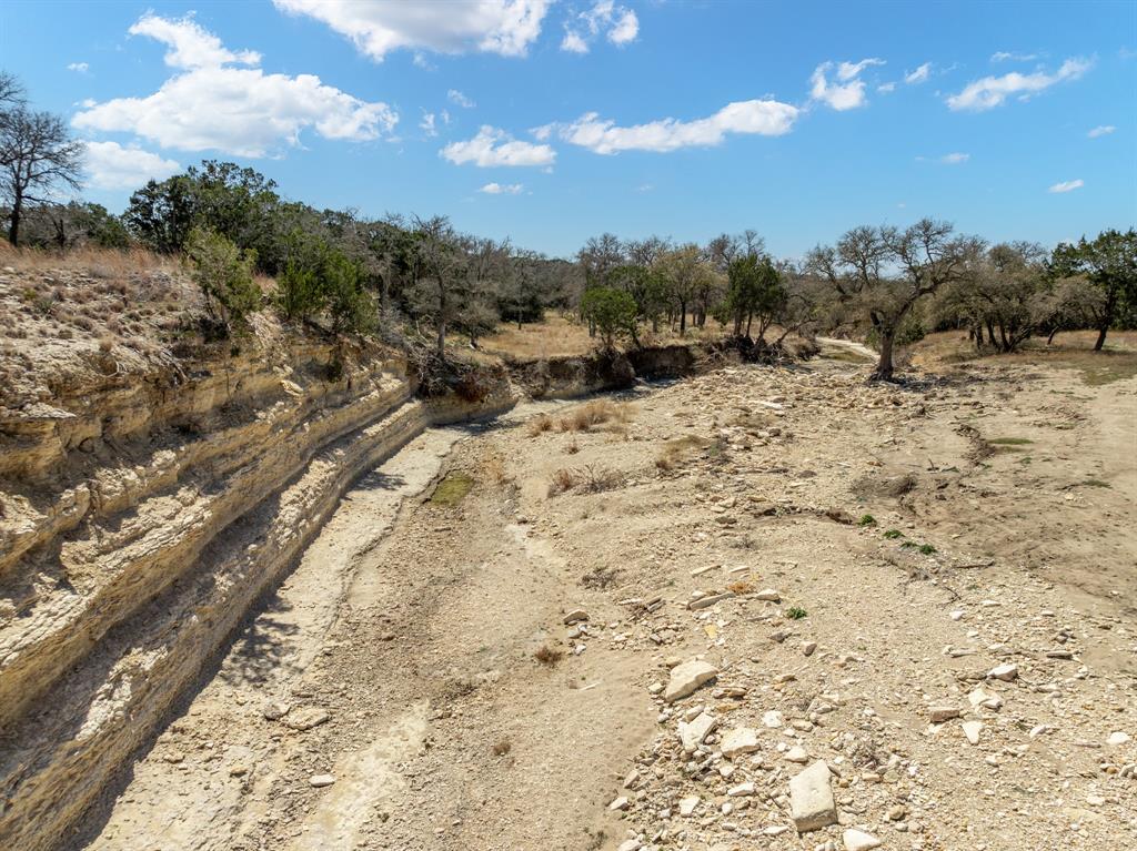 Lot 16-ph Private Road Evant, TX 76525 - Photo 4 of 23 a view of a dry yard with trees