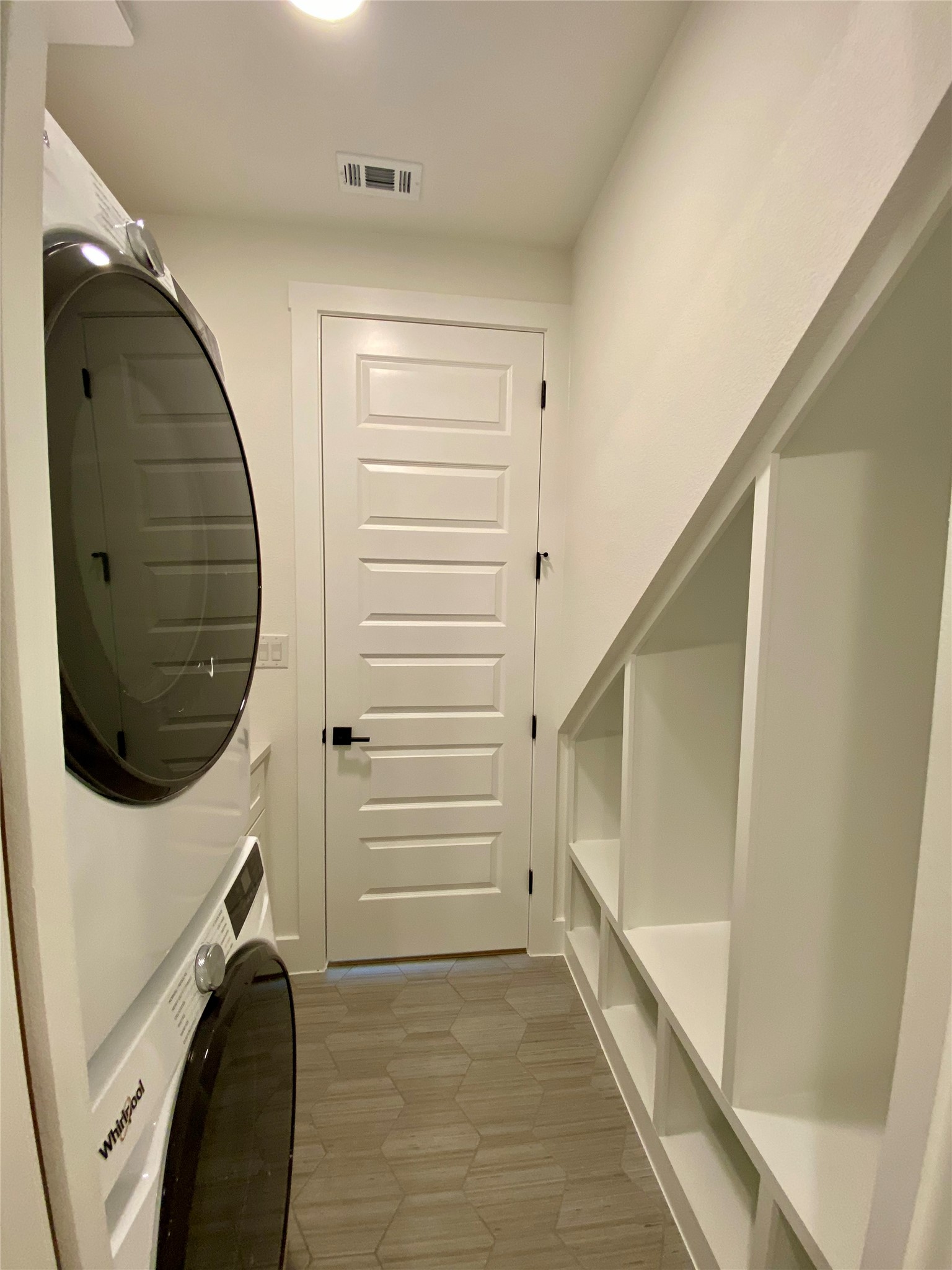 17341 Graces Path Pflugerville, TX 78660 - Photo 11 of 13 a view of a hallway with washer and dryer