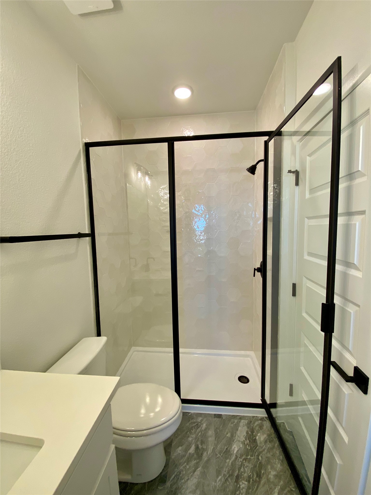17341 Graces Path Pflugerville, TX 78660 - Photo 13 of 13 a bathroom with a shower and a toilet
