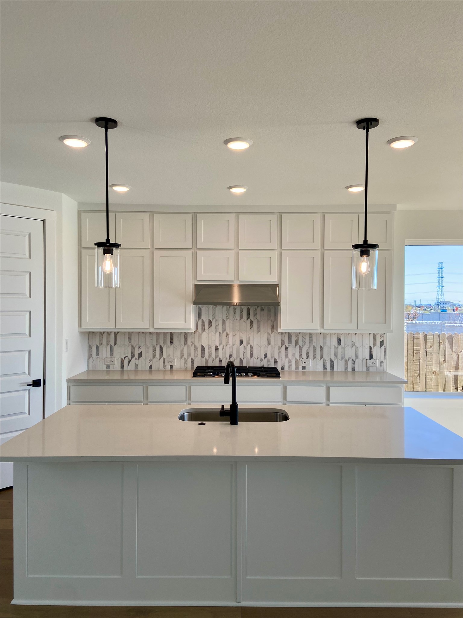 17341 Graces Path Pflugerville, TX 78660 - Photo 3 of 13 a kitchen with kitchen island stainless steel appliances sink and cabinets