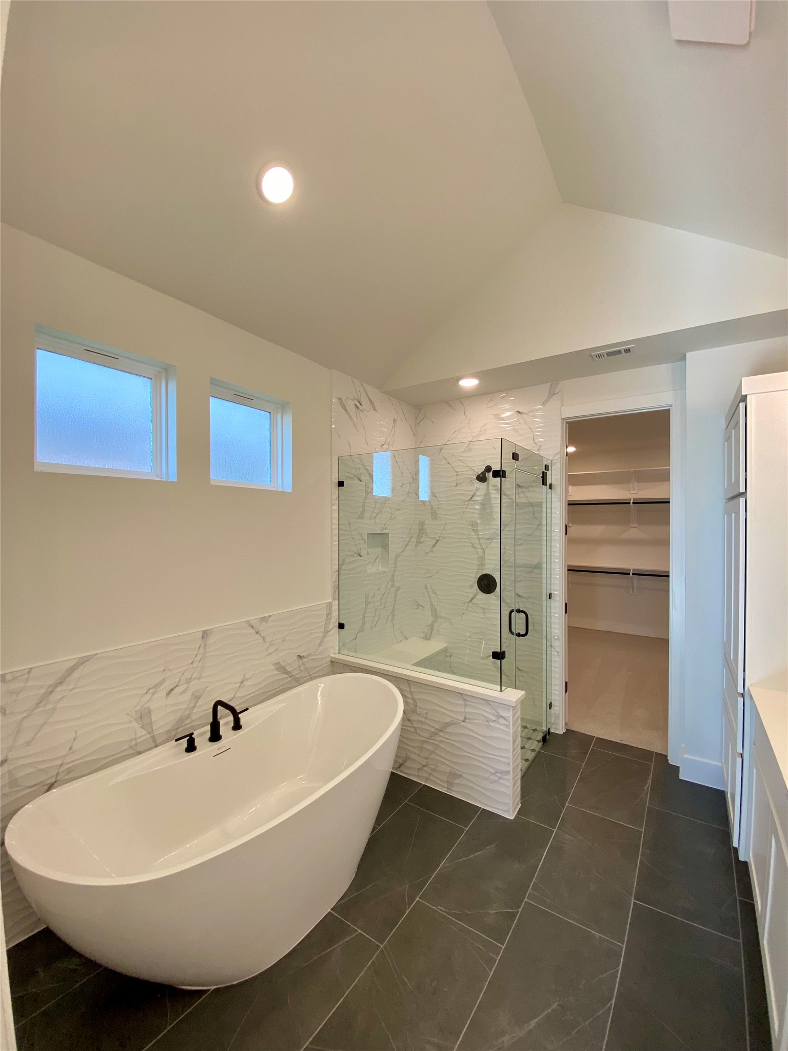 17341 Graces Path Pflugerville, TX 78660 - Photo 7 of 13 a bathroom with a bathtub and shower