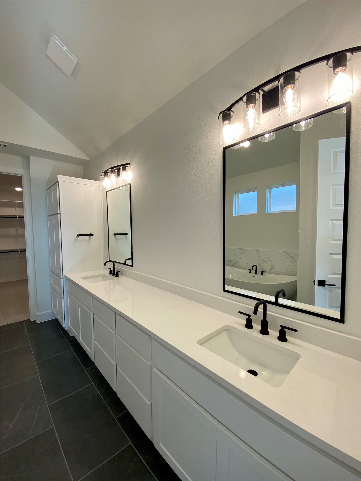 17341 Graces Path Pflugerville, TX 78660 - Photo 8 of 13 a bathroom with a double vanity sink and mirror