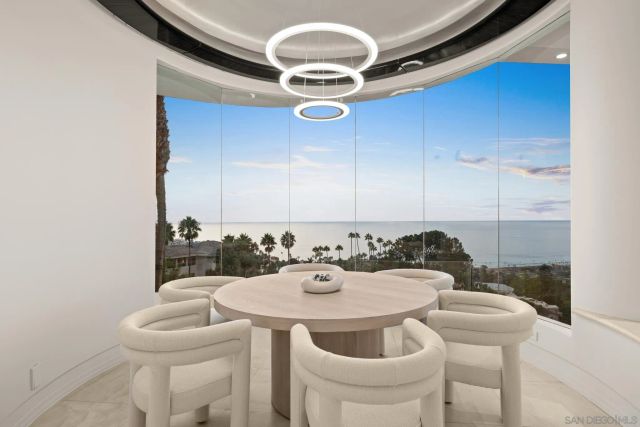 a kitchen with a table and chairs