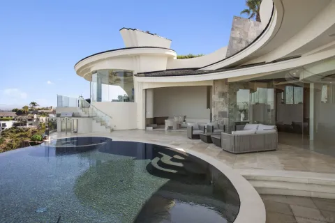 a view of a livingroom with furniture and a potted plant