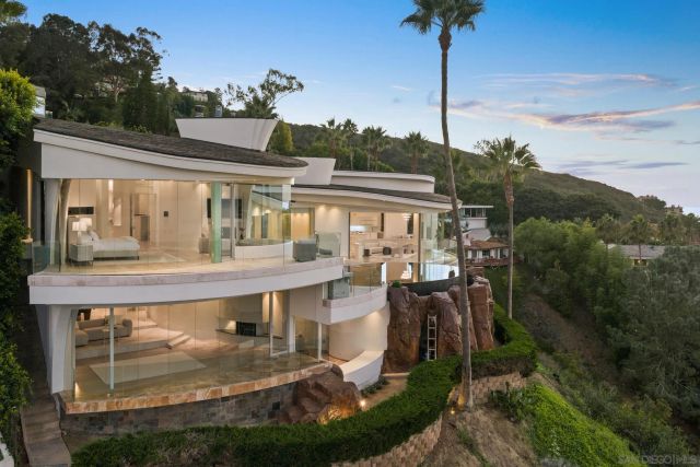 a living room with hard wood floor and furniture