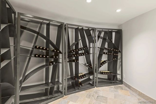 a living room with fireplace furniture and a potted plant