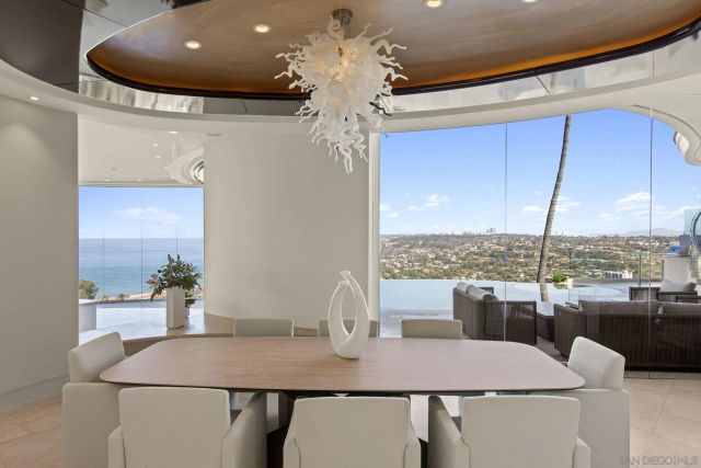 a view of a dining room with furniture window and chandelier