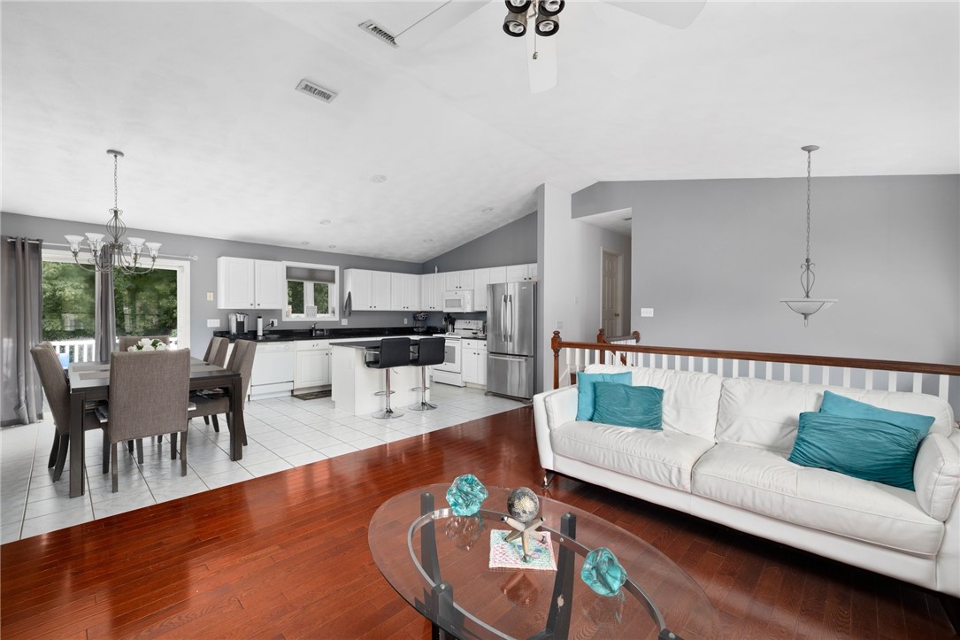 13 Lawrence Road North Providence, RI 02911 - Photo 13 of 31 Open and airy with neutral colors. Hardwood floors throughout the living room area.