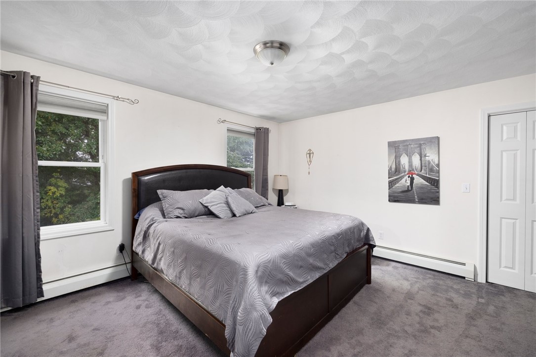 13 Lawrence Road North Providence, RI 02911 - Photo 16 of 31 Oversized master bedroom features updated carpeting.
